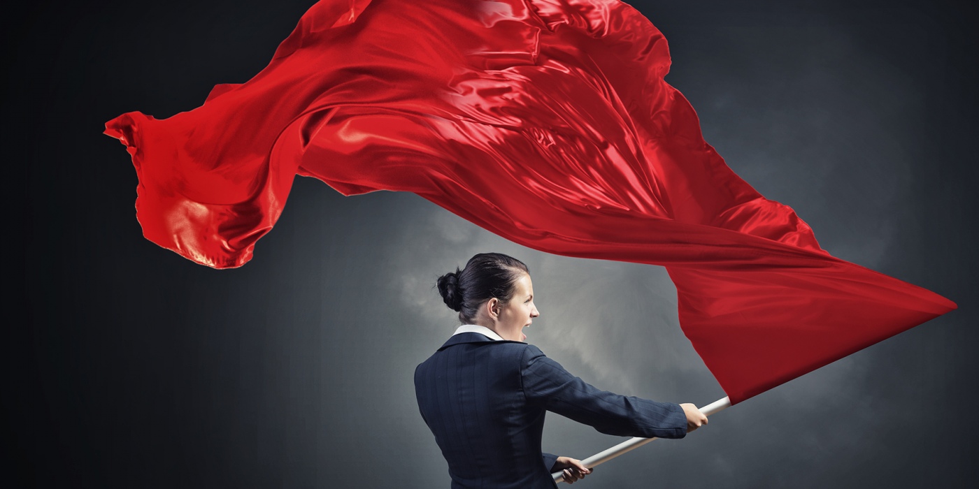 Woman waving red flag